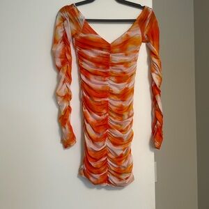 Orange and white mini dress. Tight fitting. Thumb hole